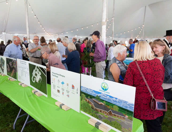 Community Kick-off attendees vieiwng hospice building plans