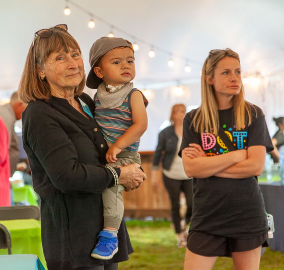 Family watching event speakers