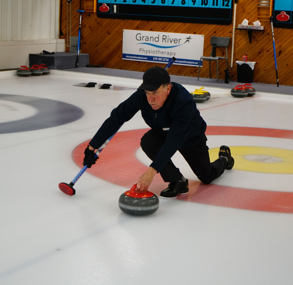 A 2024 Curl For A Cause curler aiming the rock.