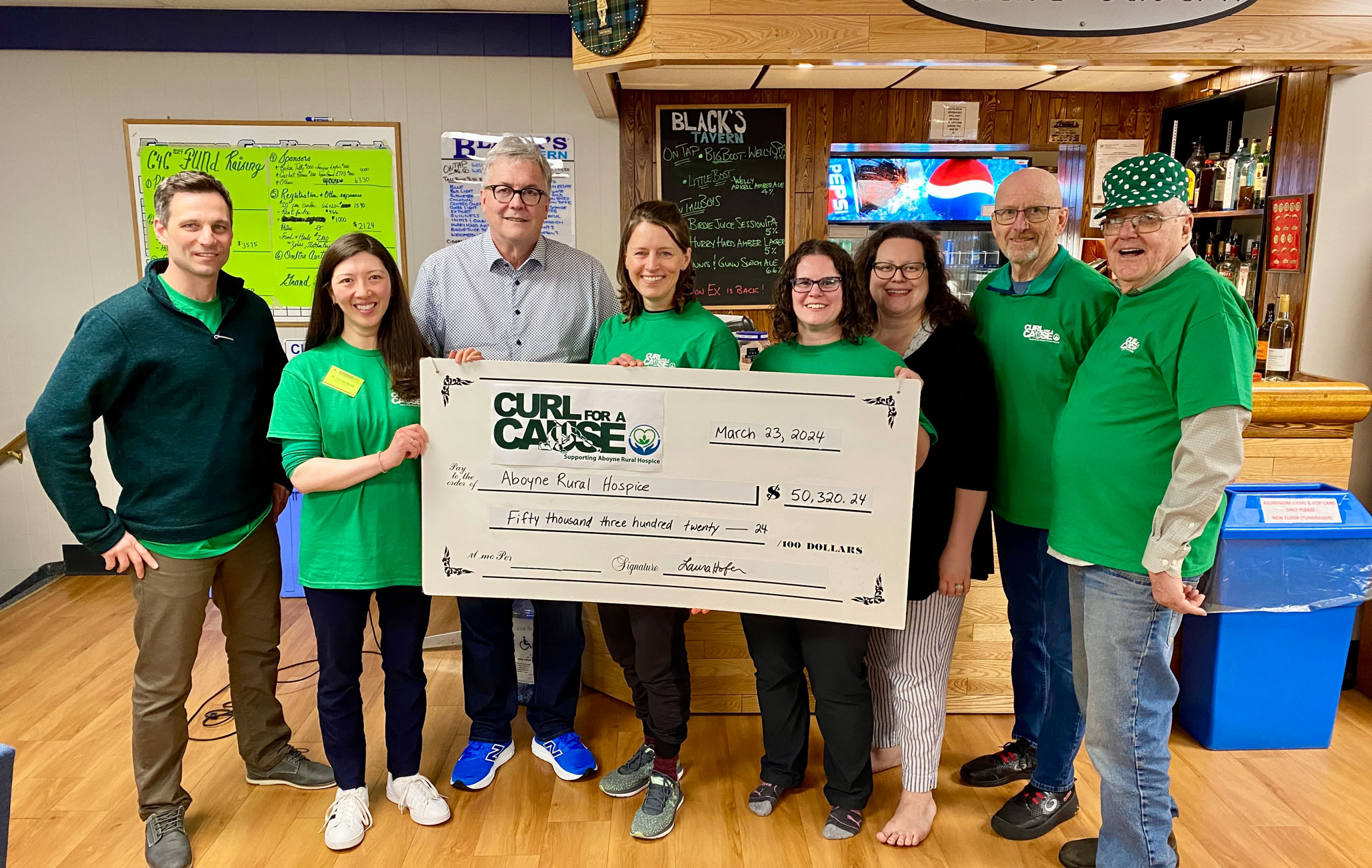 Curl For A Cause founders and Aboyne Rural Hospice representatives at cheque presentation   