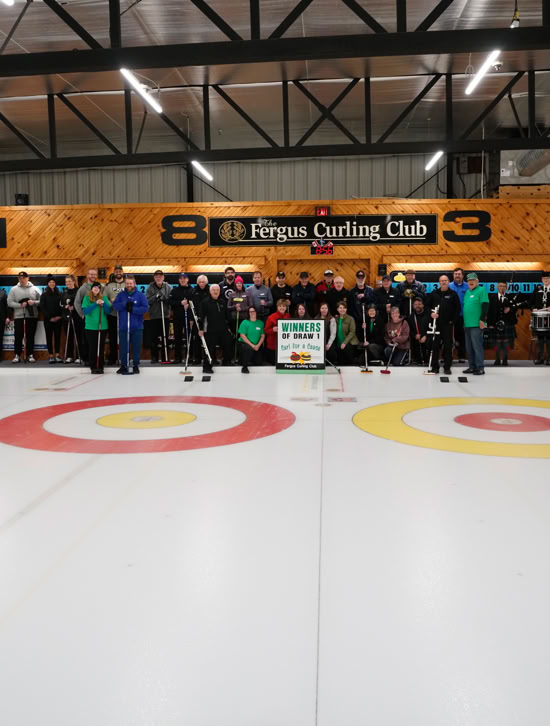 2023 Curl For A Cause attendees gathered on Fergus Curling rink ice surface.