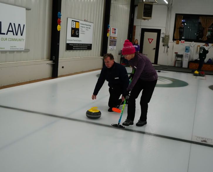 Releasing the curling rock at 2024 Curl for a Cause event.
