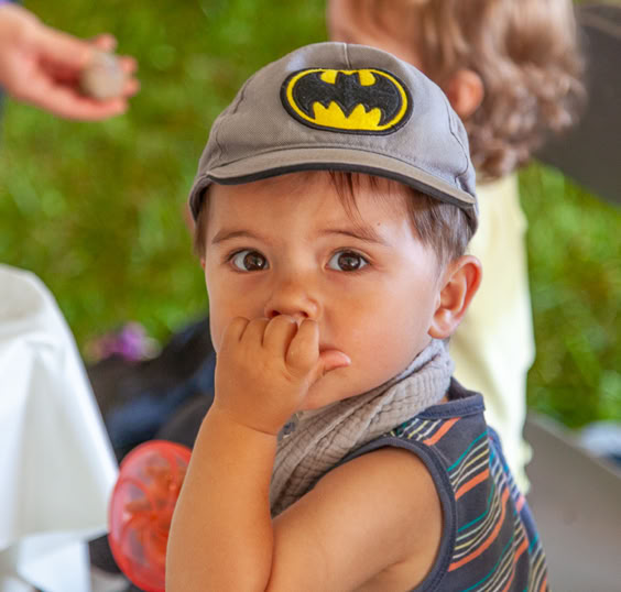 Young child watching event speakers